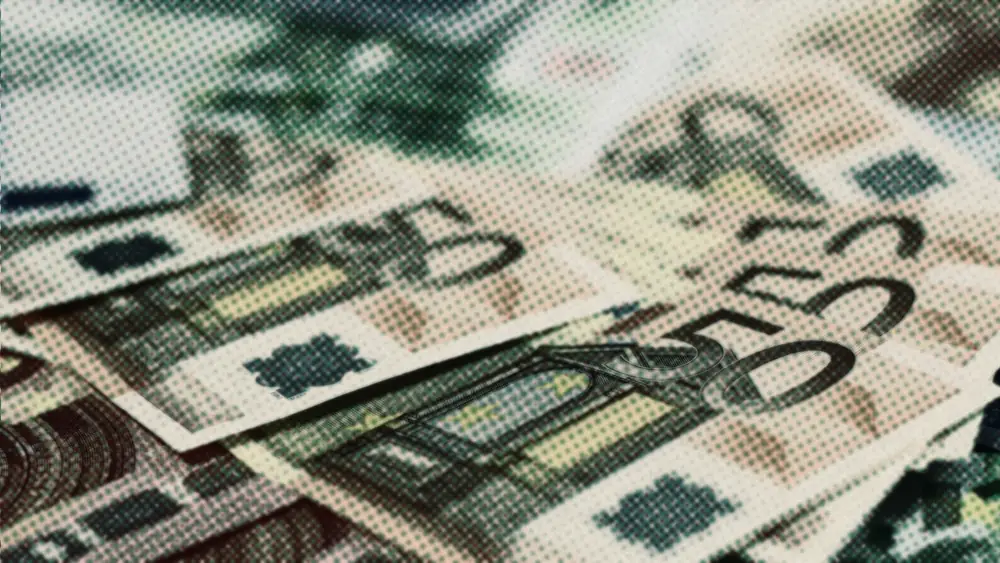 Overlapping 50 euro banknotes spread across a surface, the windfall waiting to be invested